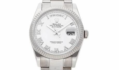 The white dial fake watch has Roman numerals.